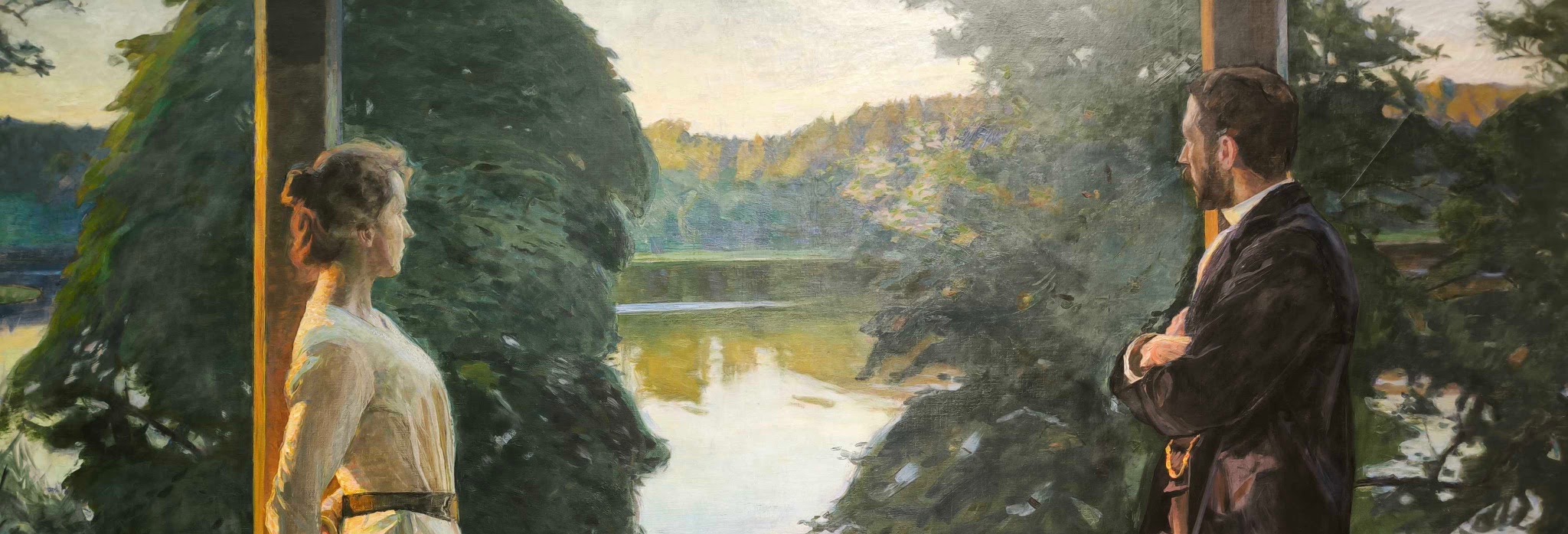 Two people standing at a balustrade overlooking a Nordic landscape at dusk